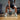 Black kettlebell in gym workout scene, durable cast-iron fitness training equipment